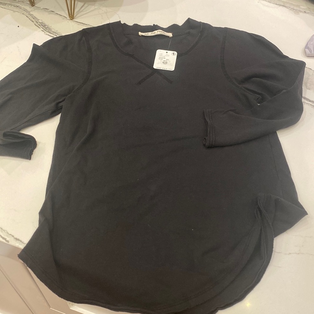 We the free AXs top NWT